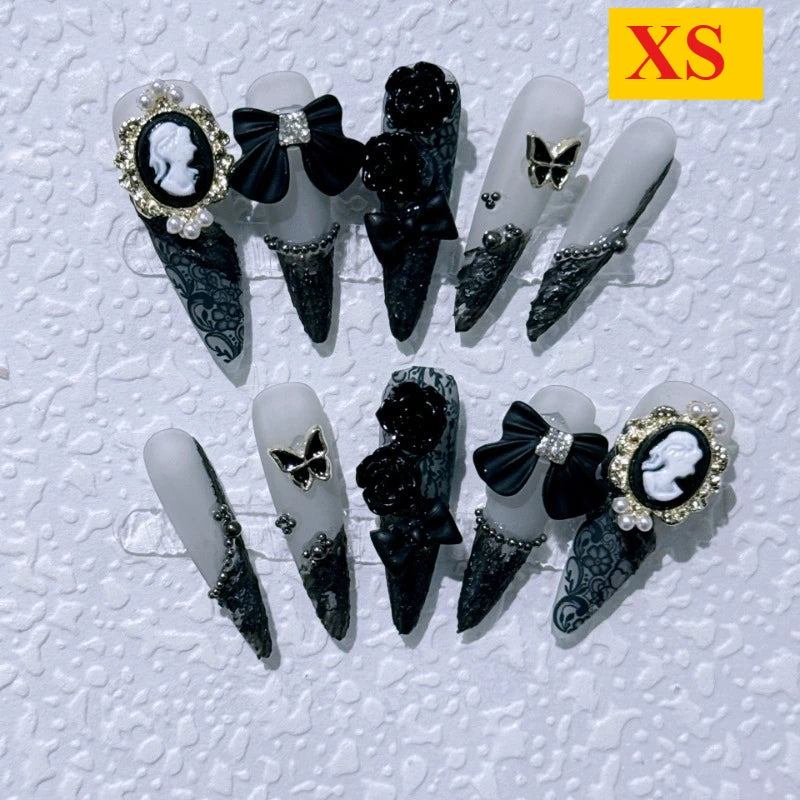 Handgjorda press-on naglar – rosa med svarta rosetter, återanvändbara